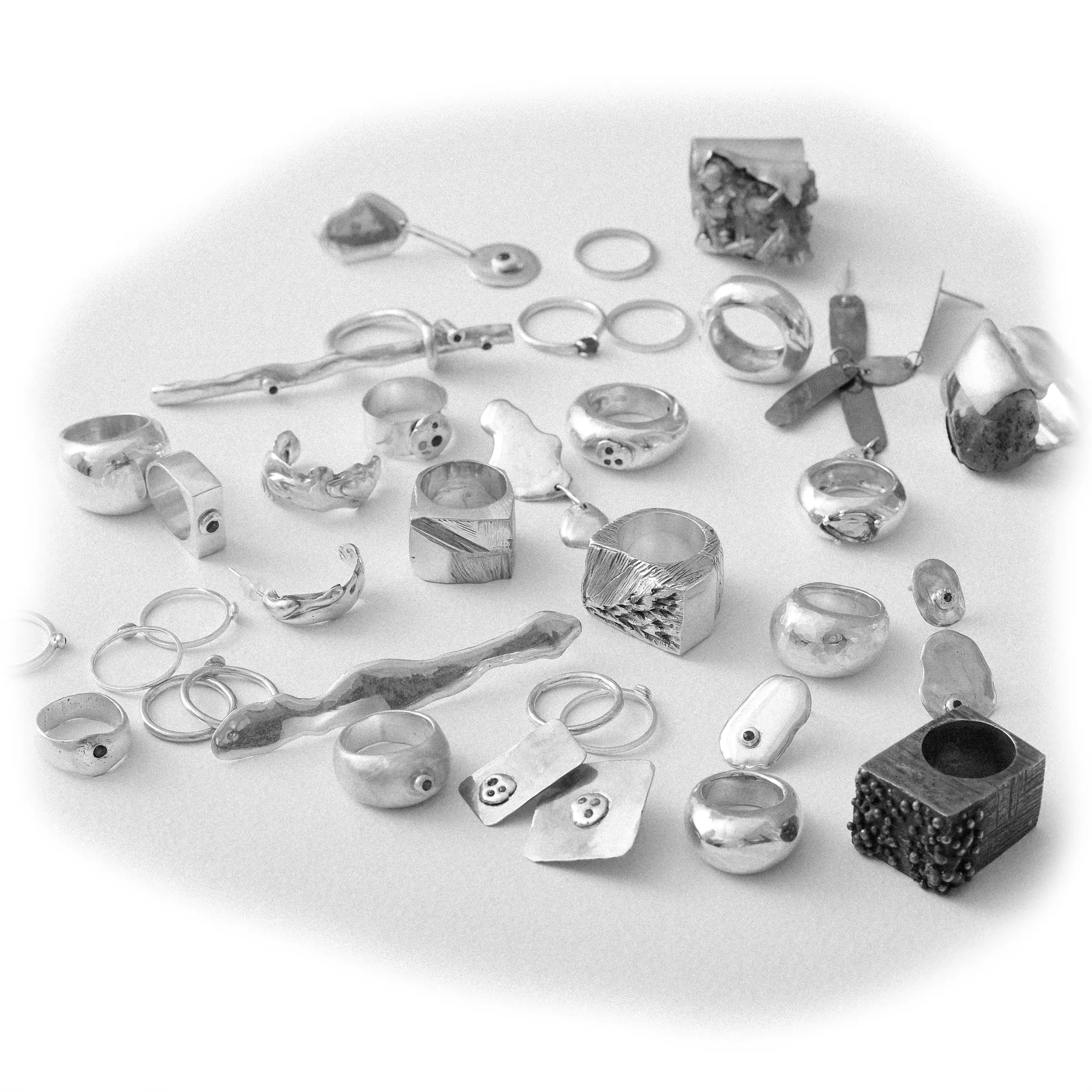 Many custom silver pieces photographed from above