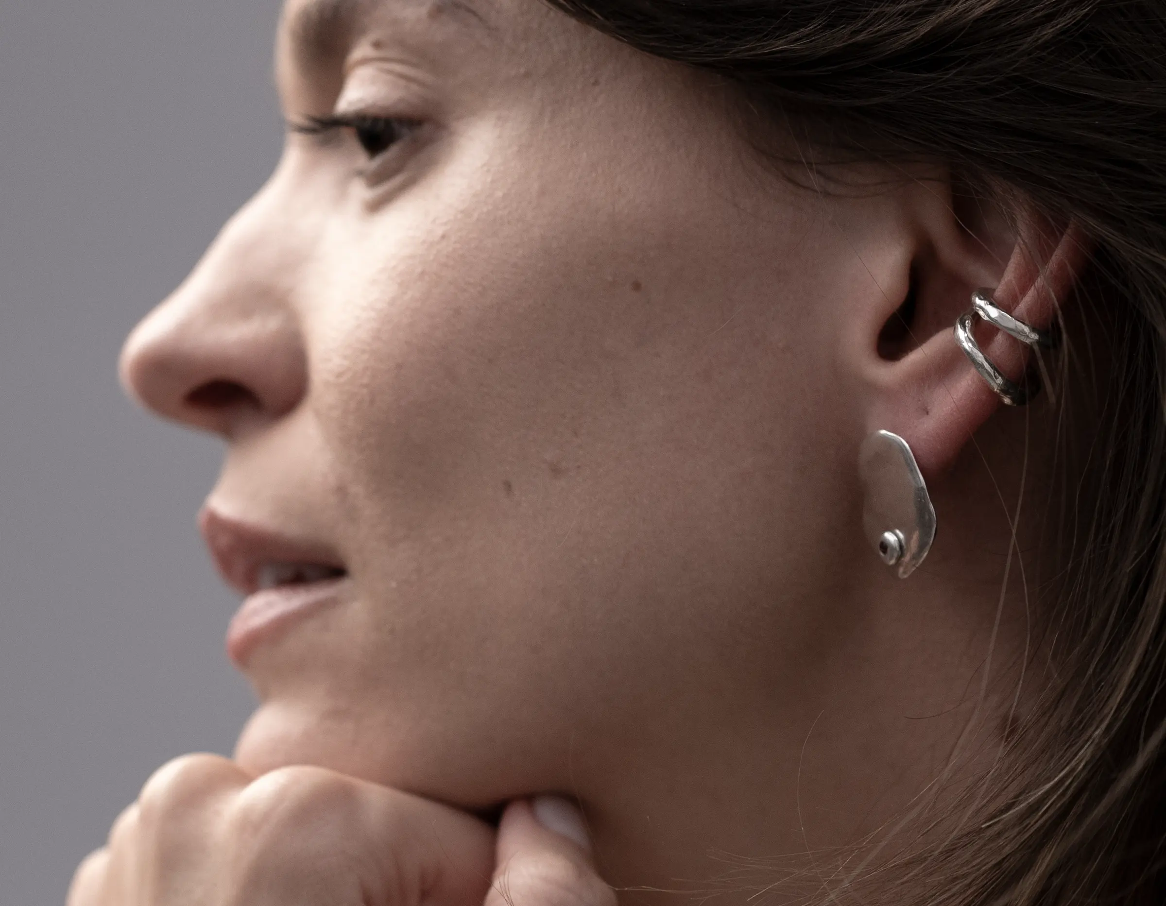 Melt ear cuff and rings worn