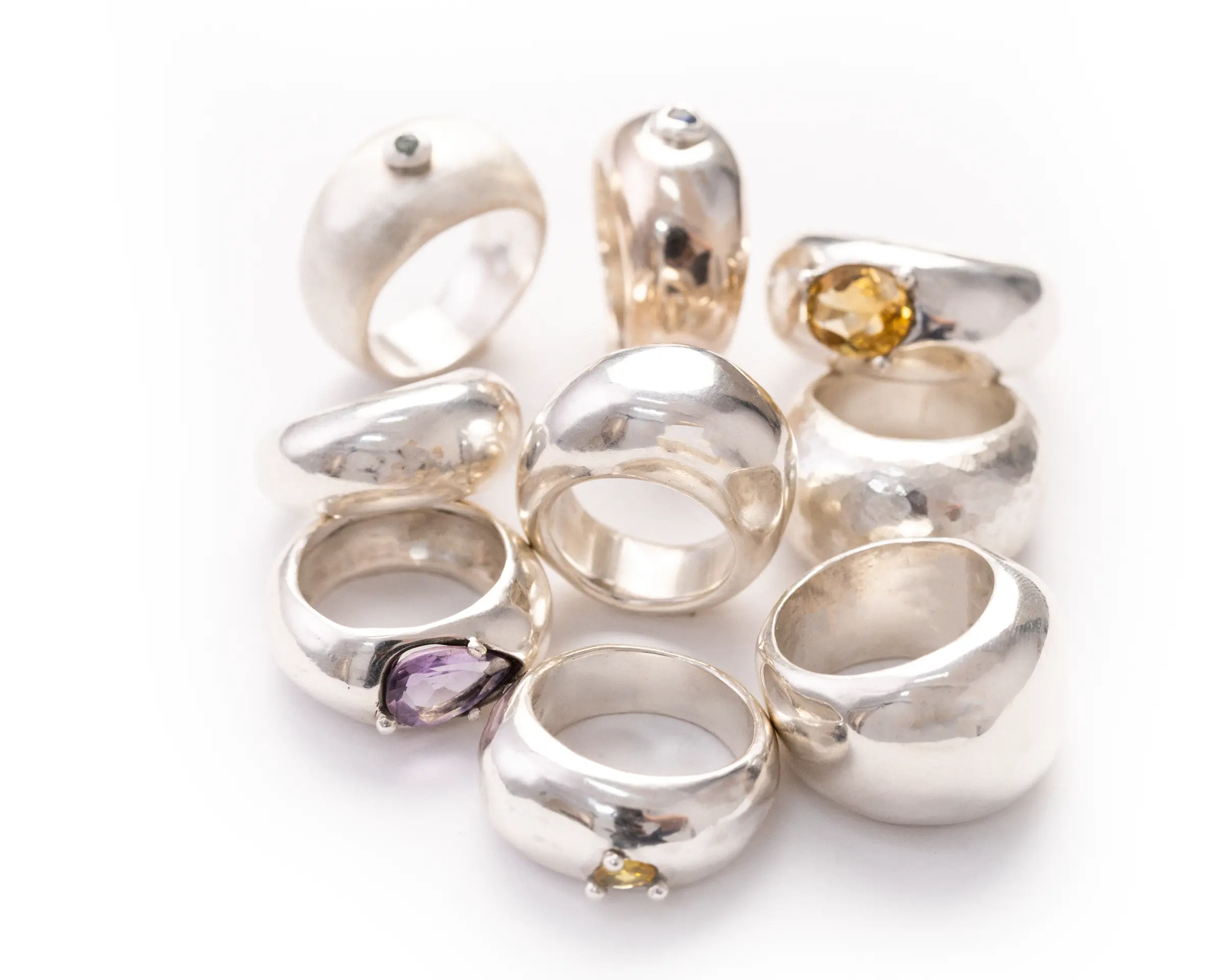 A pile of Stackable rings with coloured stones